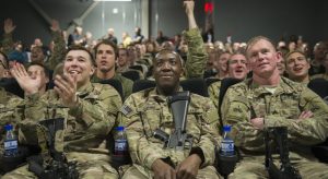 Service members deployed to Bagram Air Field, Afghanistan, clap and cheer as they prepare to view first showing of "Star Wars: The Force Awakens," here, Dec. 22, 2015. The Army & Air Force Exchange Service partnered with Walt Disney Studios to give service members a chance to see the movie in a deployed location. (U.S. Air Force photo by Tech. Sgt. Robert Cloys)