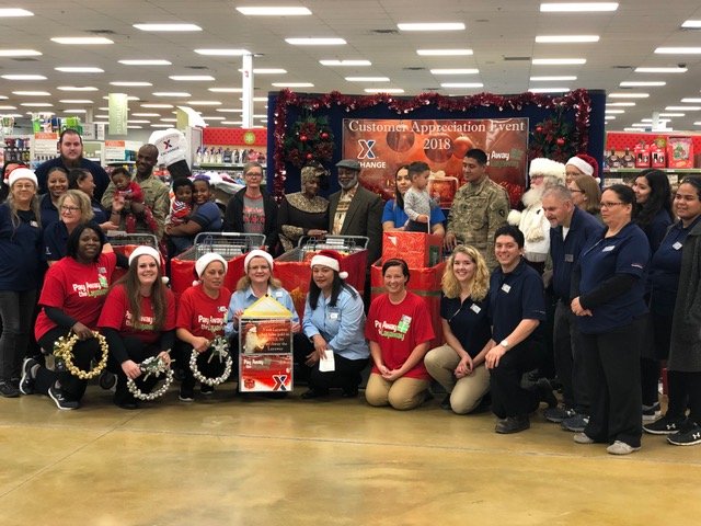 Fort Polk Exchange associates and shoppers pose following the Pay Away the Layaway event held on Nov. 29. 2018