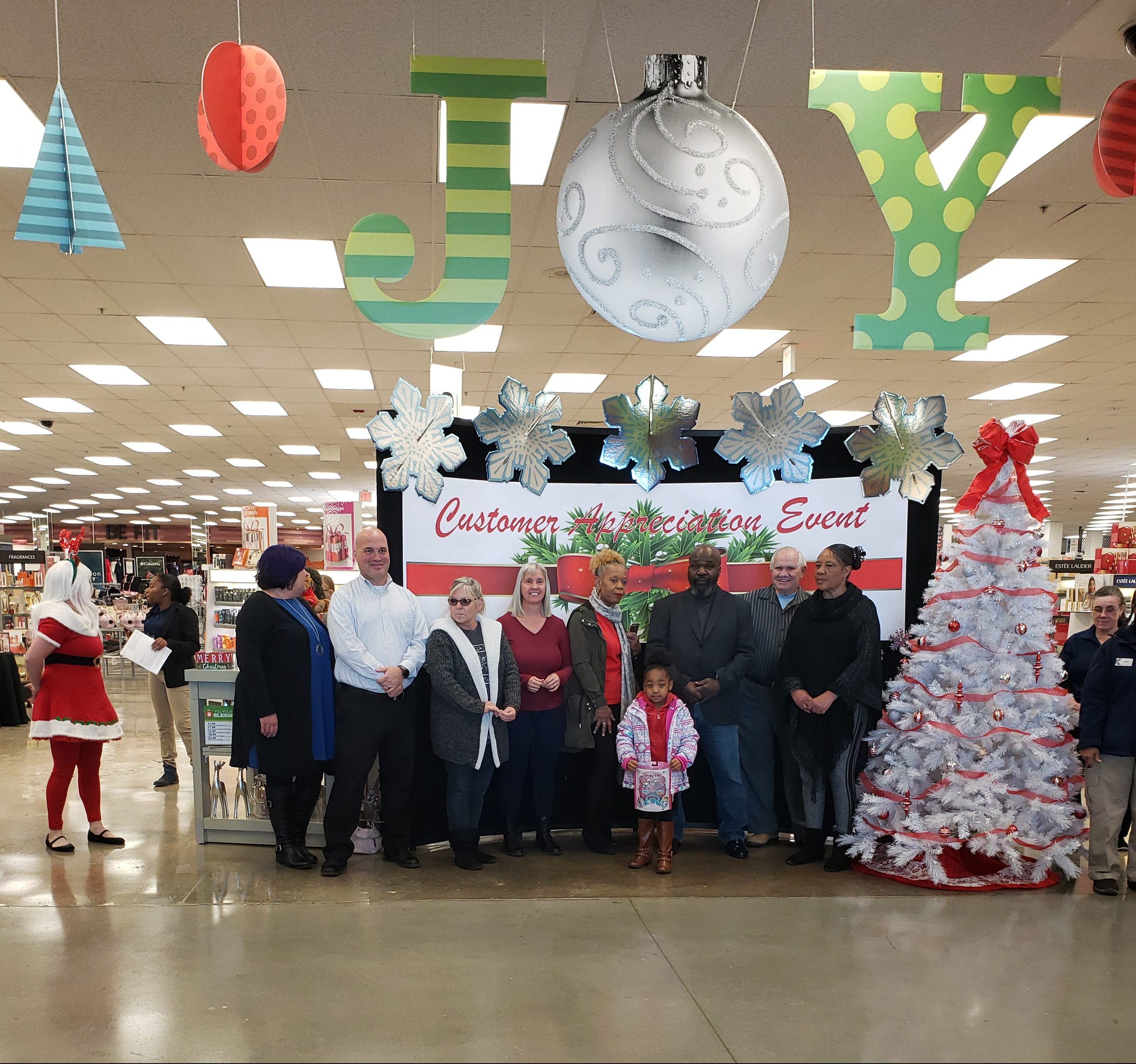 Langley Exchange associates and shoppers pose following the Pay Away the Layaway event held on Nov. 29. 2018