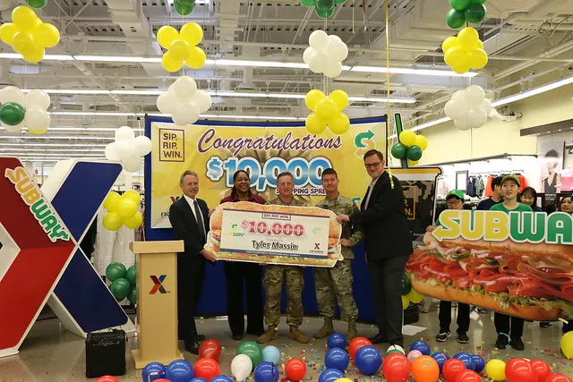 Left to right - Exchange Pacific Region Vice President Rick Fair; Camp Humphreys Exchange Store Manager Debra Melton; Pfc. Tyler Massie; Brig. Gen. Patrick J. Donahoe, 8th Army Deputy Commanding General of Operations; and Exchange General Manager Scott Bonner present Massie with his $10,000 shopping spree.