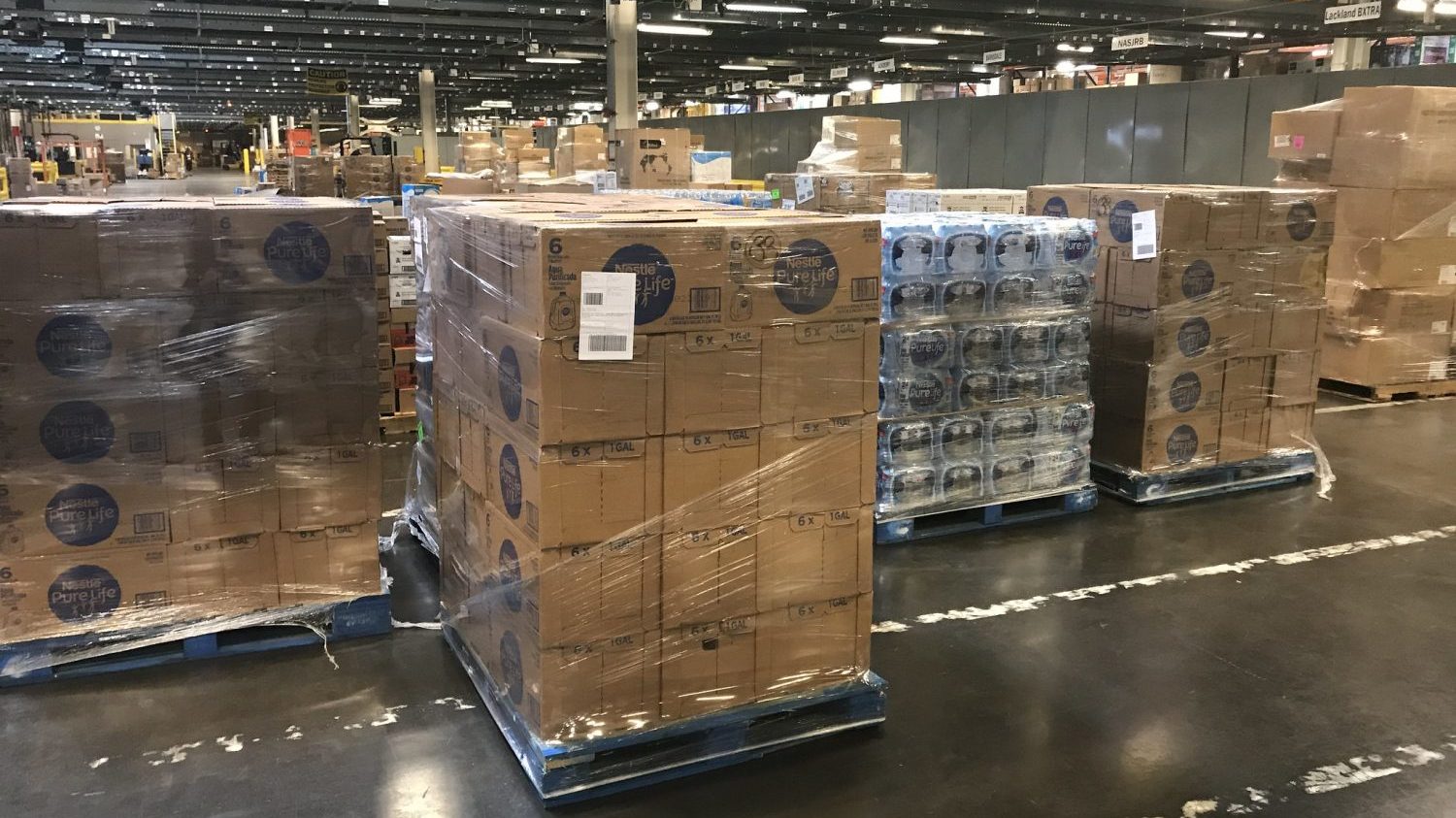 pallet wrapped in plastic sitting in a warehouse