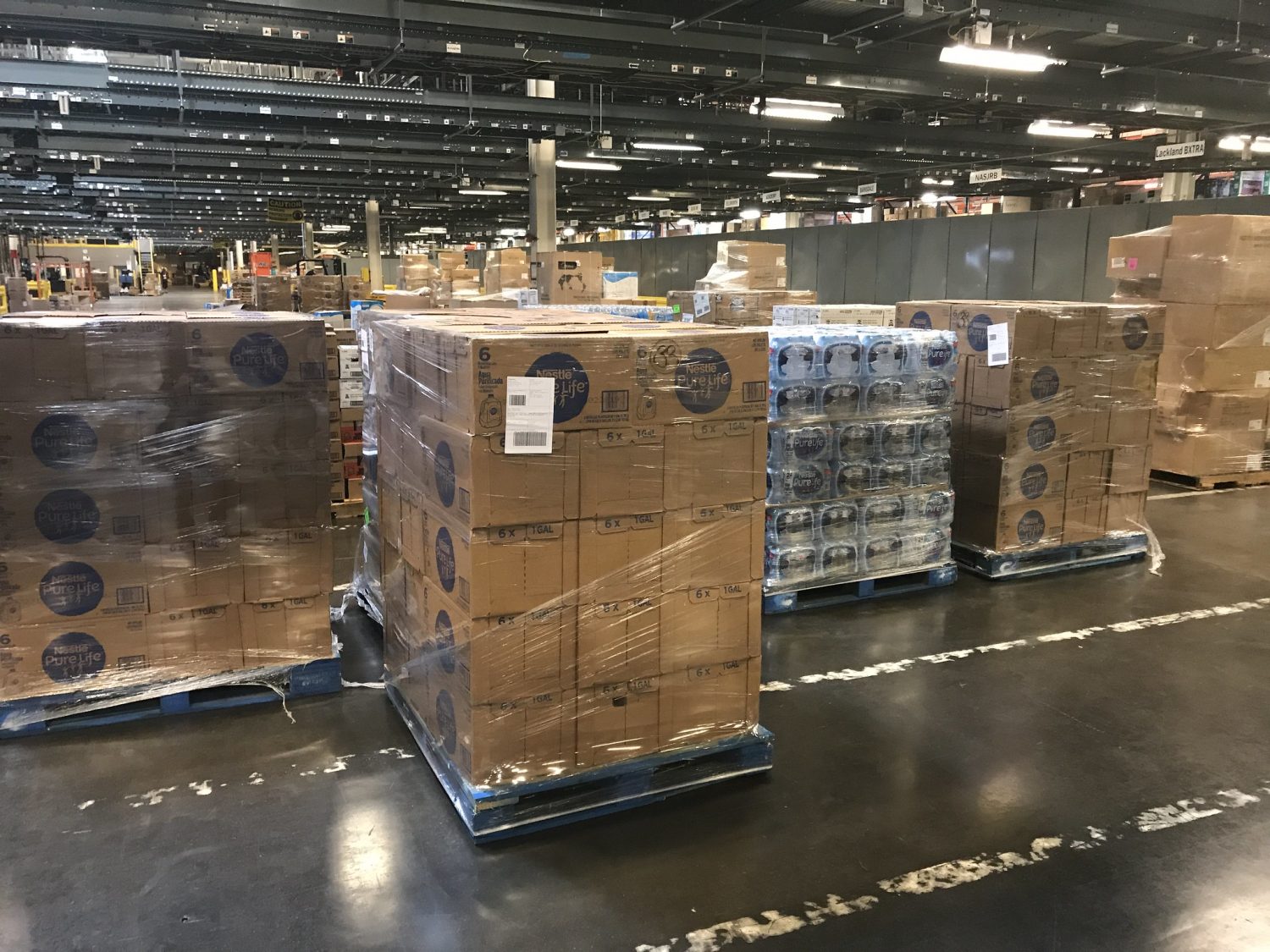 pallet wrapped in plastic sitting in a warehouse