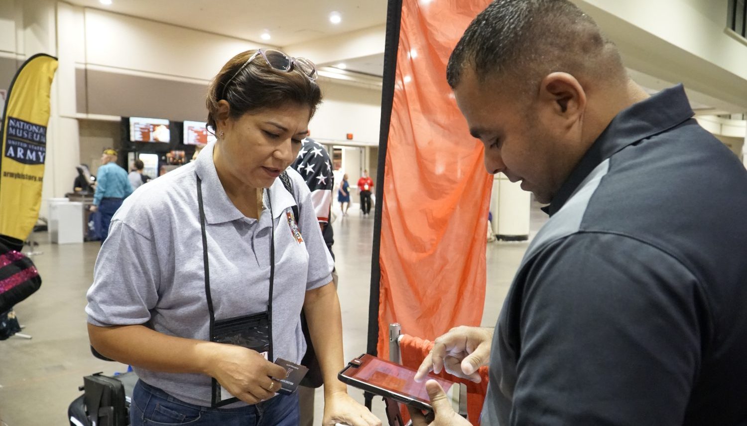 Army Veteran Francis Cordero Medina learns how to sign up for tax-free shopping at ShopMyExchange.com with help from Exchange Veteran Service