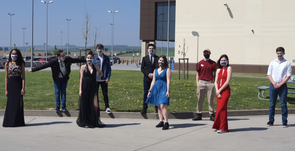 Spangdahlem High School students pose in their formal wear before their shift at the Spangdahlem Exchange on April 25, the day of the high school's cancelled prom.