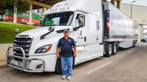 Bruce Cameron in front of Exchange truck