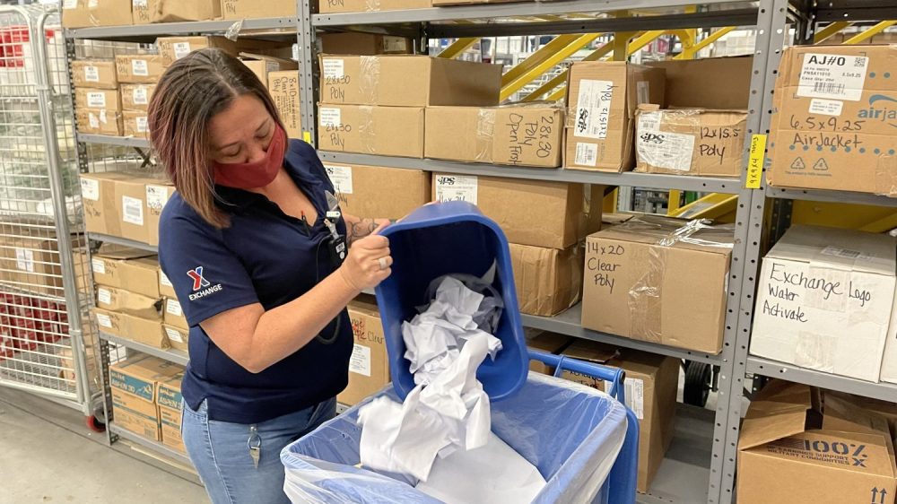 Earth Day - Associate recycling paper at Fort Hood