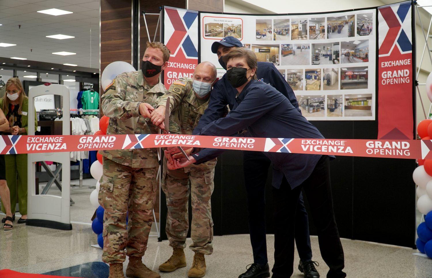 USAG Italy command and Exchange associates cut the ribbon on the updated Exchange a Vicenza.