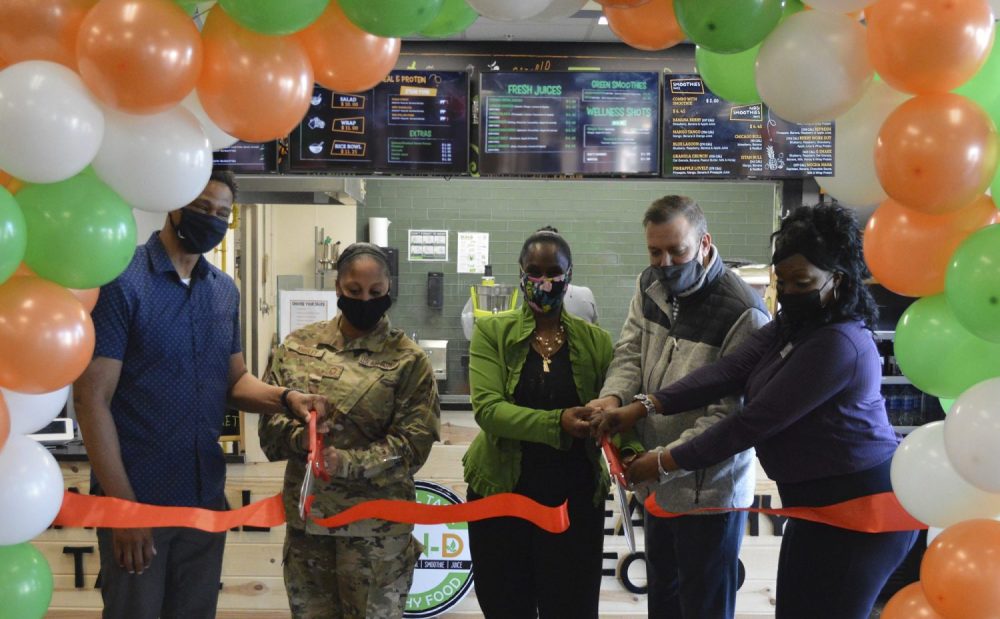 Photo of 78th Force Support Squadron Senior Enlisted Leader Kathleen Knisley and Robins Air Force Base Exchange officials cutting the ribbon on the base's new Bun-D restaurant Feb. 16.