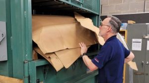 Fort Carson Exchange Military Clothing Warehouse Worker James Vick recycles cardboard, one of the many ways the Exchange reduces waste.