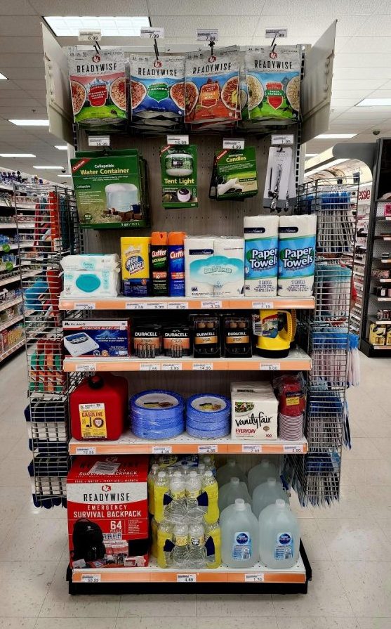 A selection of emergency meals, portable lights, paper towels, batteries, bottled water and other hurricane preparedness supplies on display at the Tyndall Air Force Base BX in Florida.