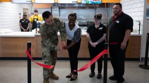 633rd Mission Support Group Commander Col. Allen Herritage helps Langley Exchange General Manager Melanie White cut the ribbon on the new Qdoba Mexican Eats at the Langley AFB BX food court on June 1. (U.S. Air Force photos by Airman 1st Class Olivia Bithell)