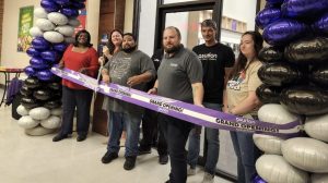 From left, Fort Stewart Exchange Services Business Manager Angela Crowell, Exchange General Manager Hollie Heft, Fort Stewart Asurion Tech Repair & Solutions Store Manager Antonio Mason, Asurion Tech Repair & Solutions District Manager Billy Gibson, Asurion Tech Repair & Solutions Lead Technician Madalin Moldovan and Asurion Tech Repair & Solutions Technician Emily Brice cut the ribbon on the Asurion Tech Repair & Solutions store at the Fort Stewart Exchange on July 25.