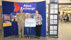 Student Kamryn Hendrickson poses with military and Exchange leaders.